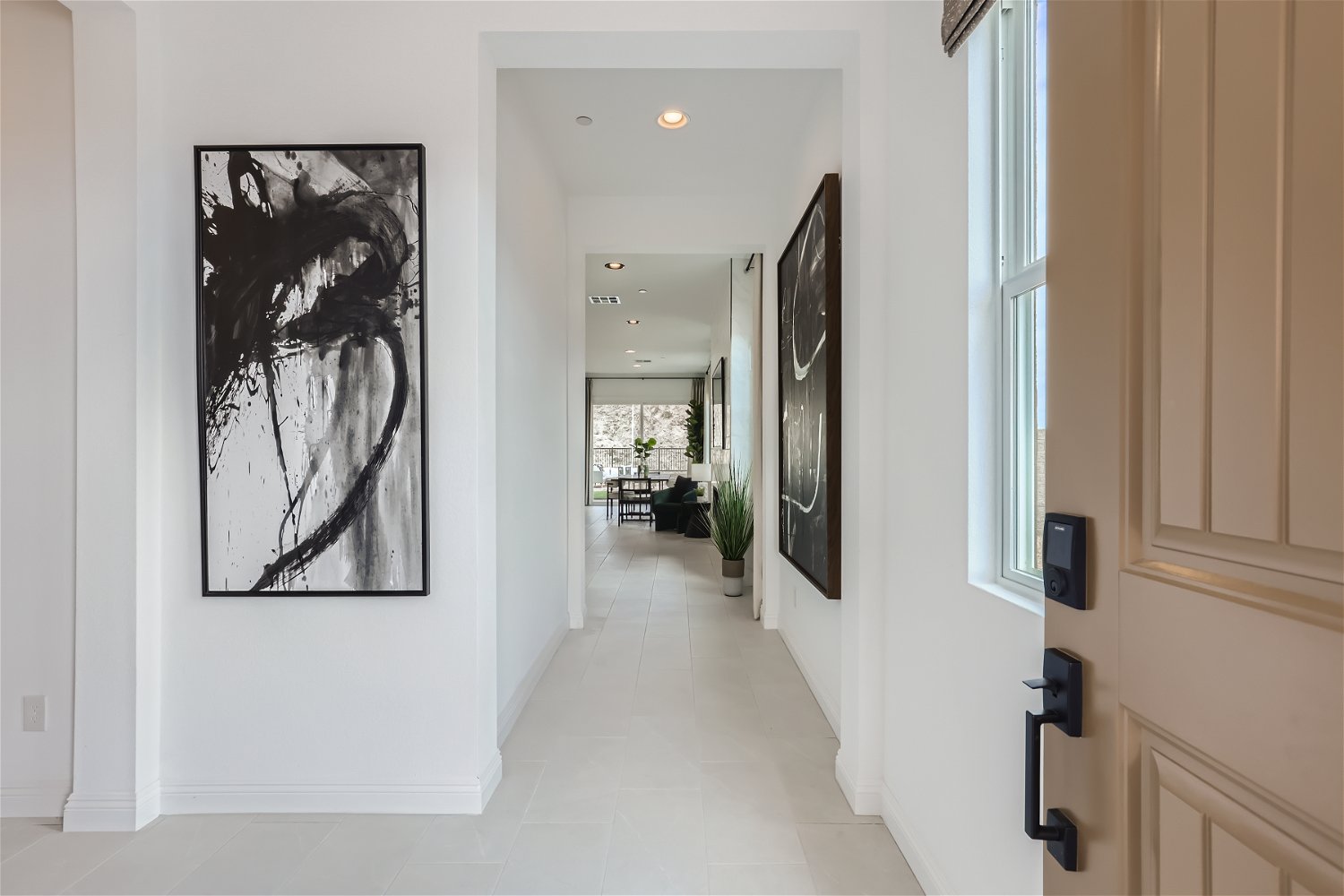 A hallway with a painting on the wall.