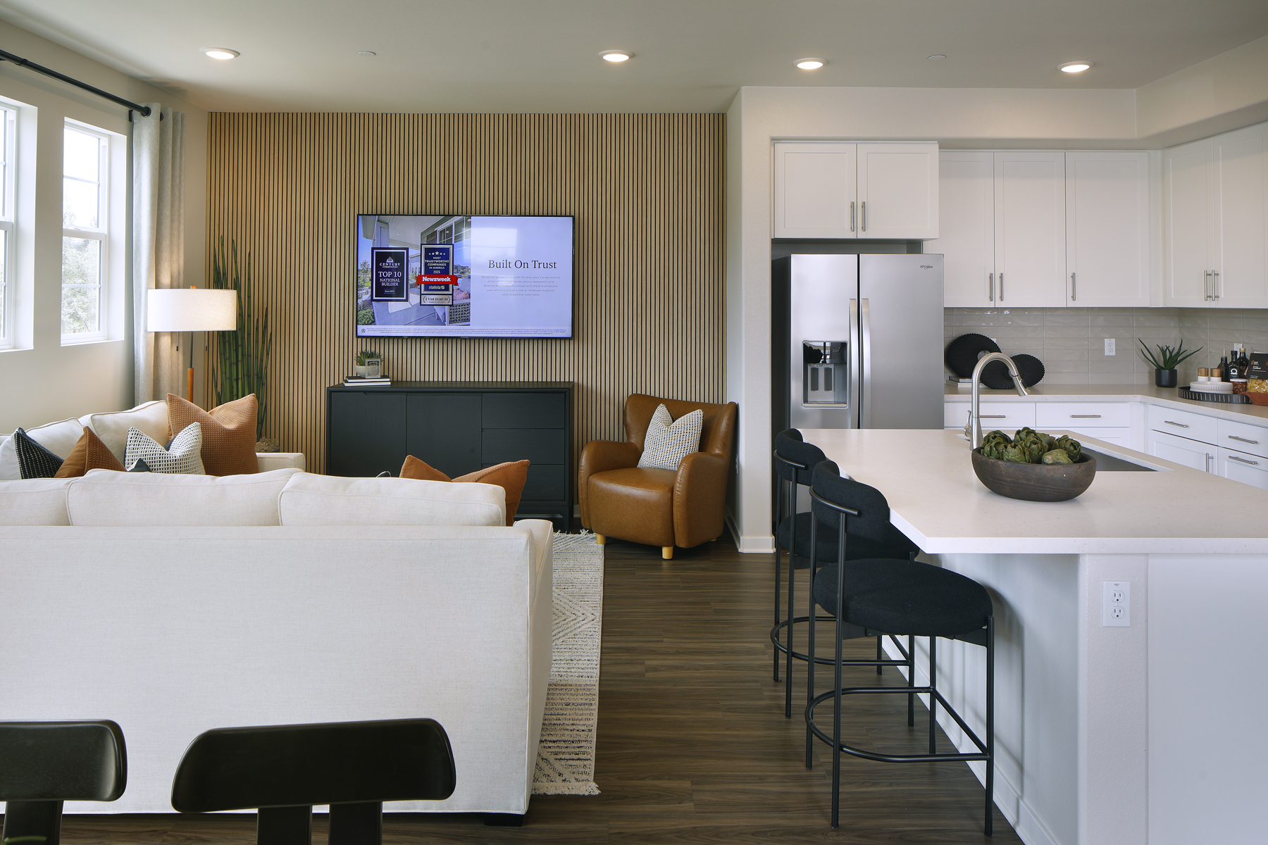 A living room with a tv and couches.