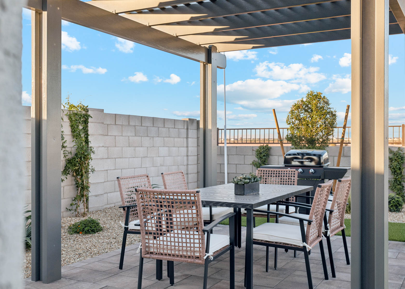 A table and chairs on a patio.