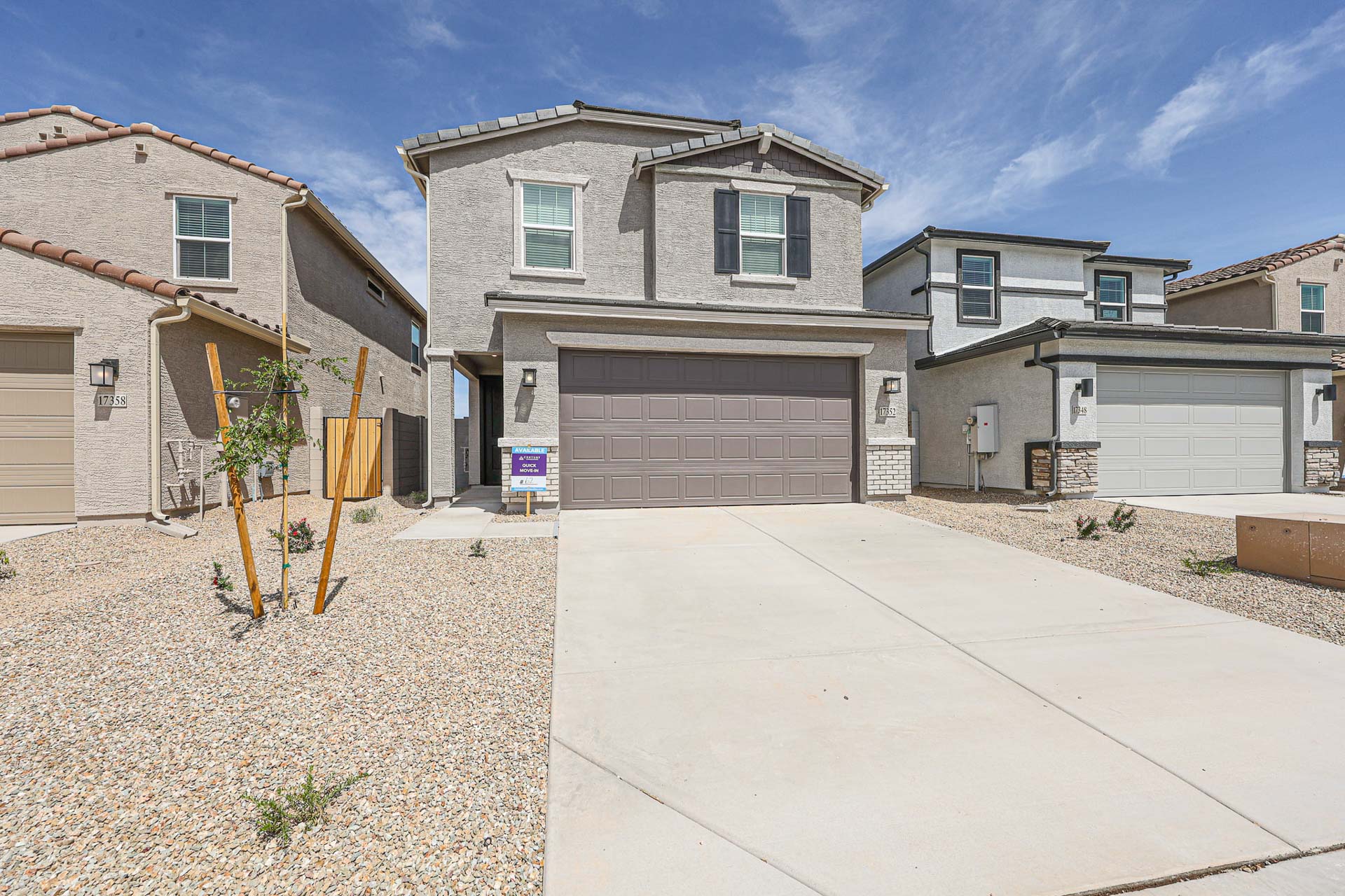 A driveway leading to a house.