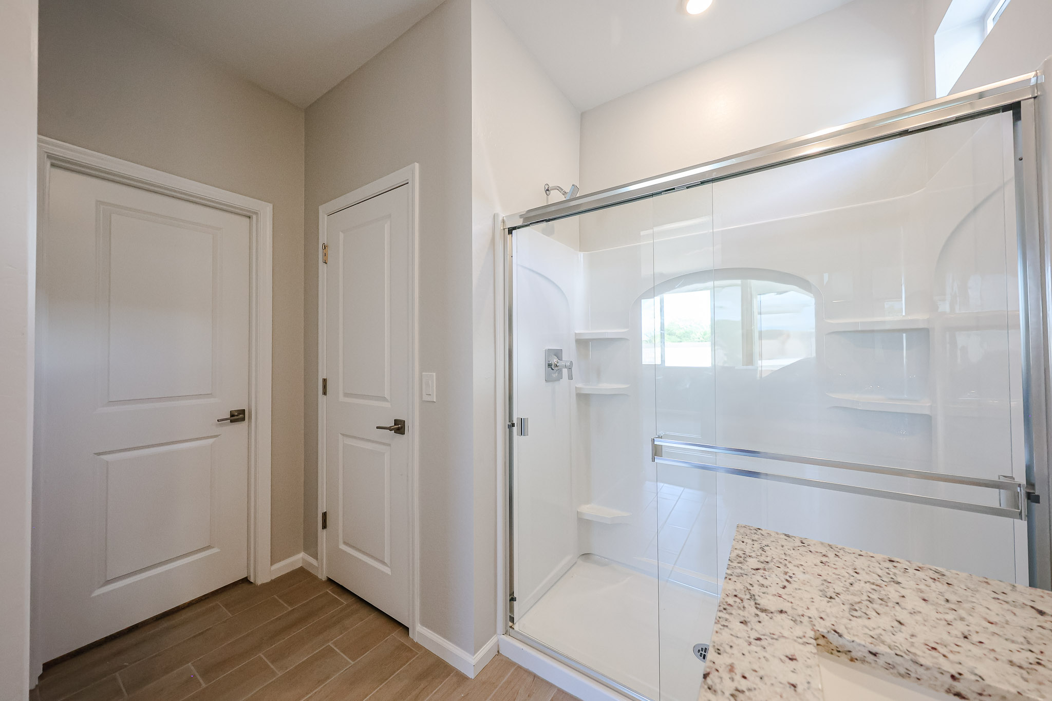 A bathroom with a glass shower.