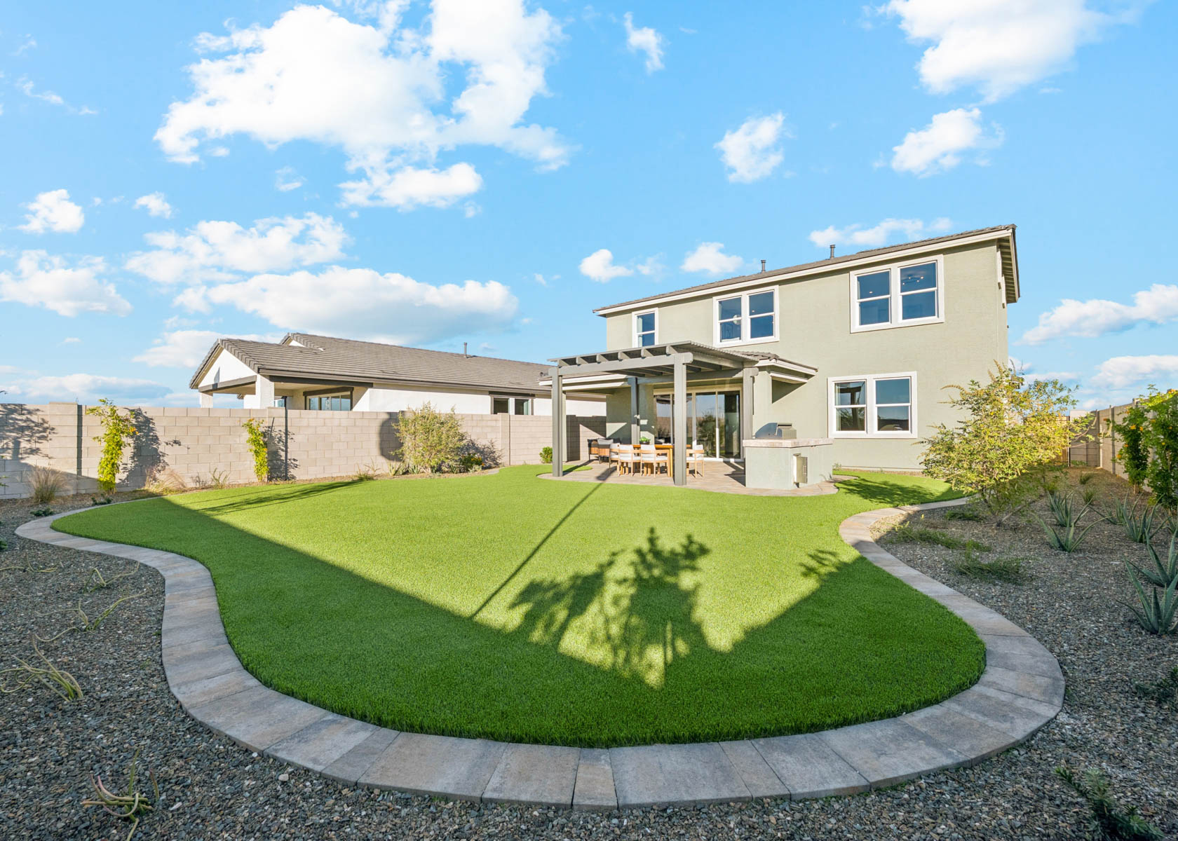 A house with a large lawn.