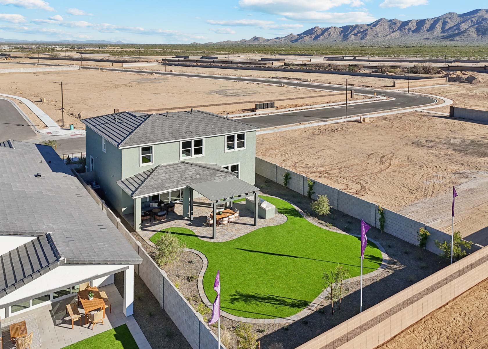 A house with a grass yard.