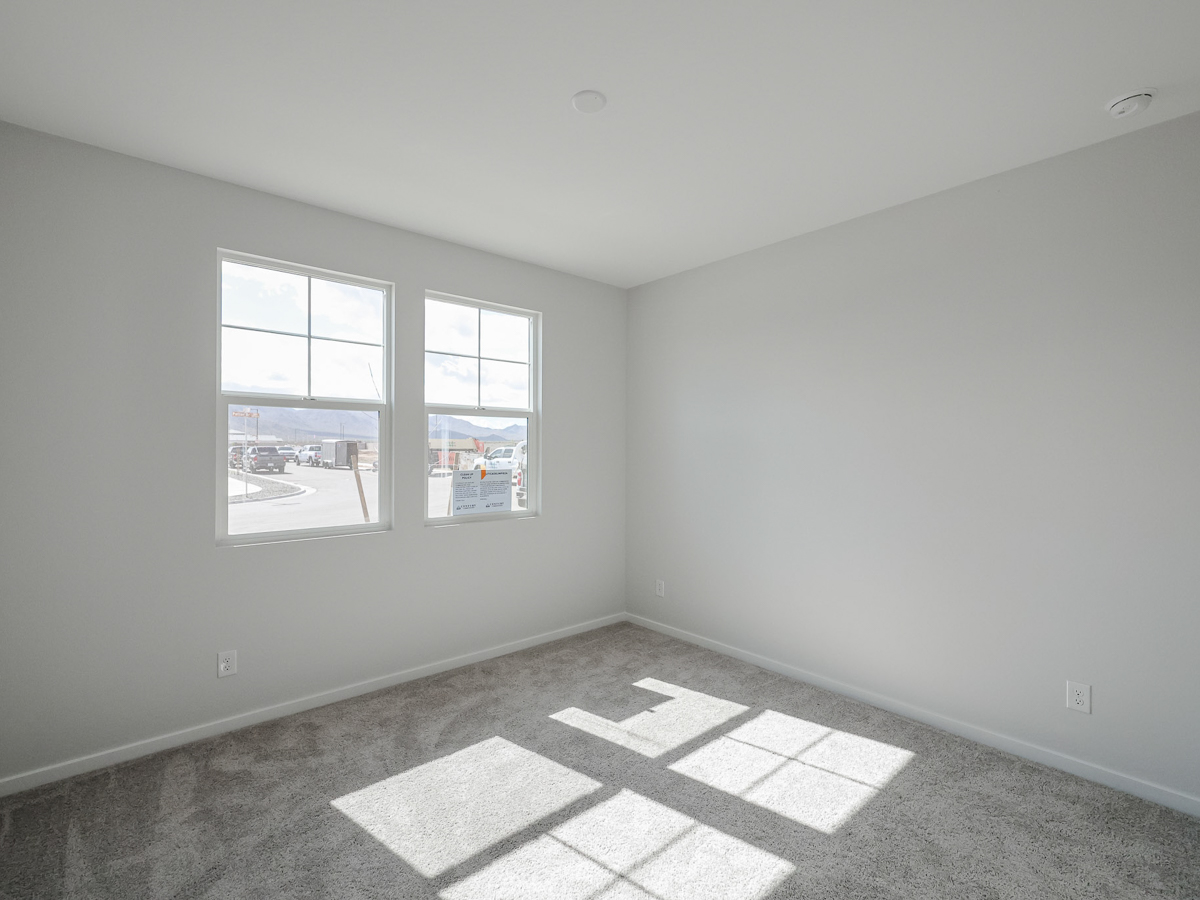 A room with a tile floor and windows.