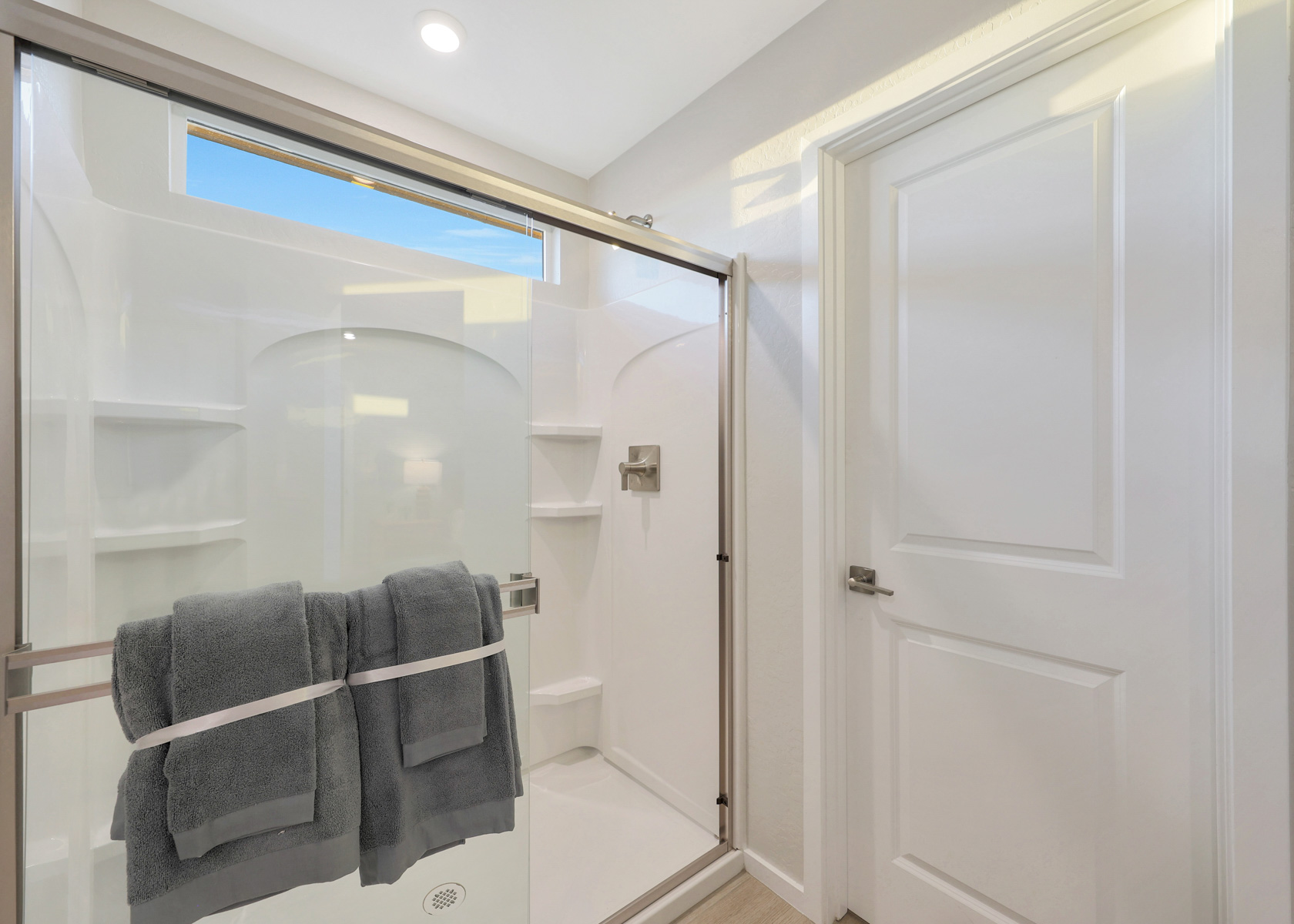 A bathroom with a glass shower.