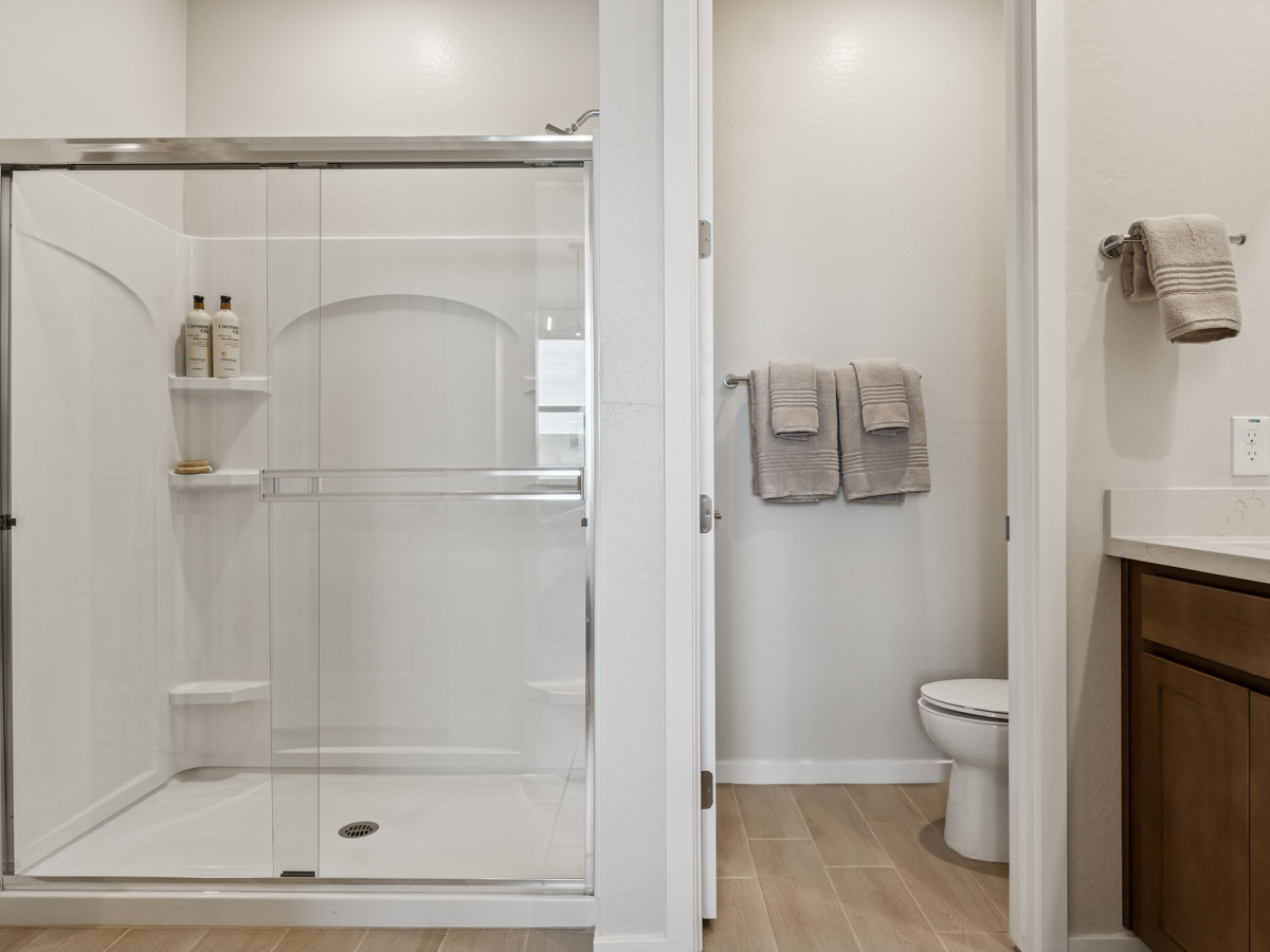 A bathroom with a glass shower.