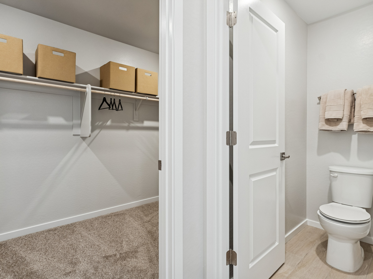 A bathroom with a toilet and shower.