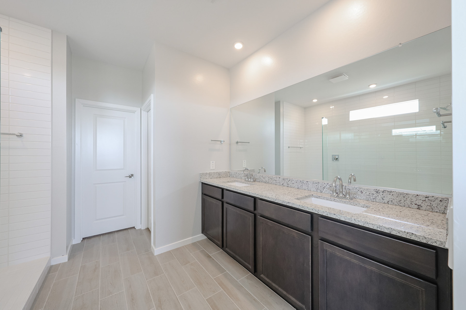 A bathroom with a marble countertop.