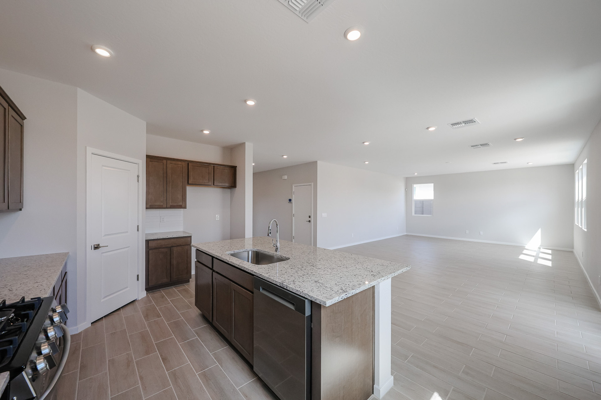 A kitchen with a marble countertop.