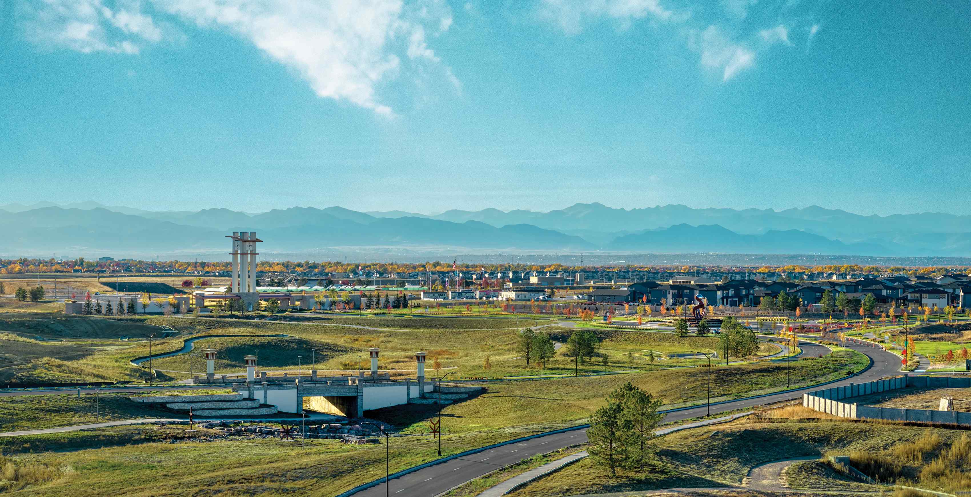 A landscape with a factory in the distance.