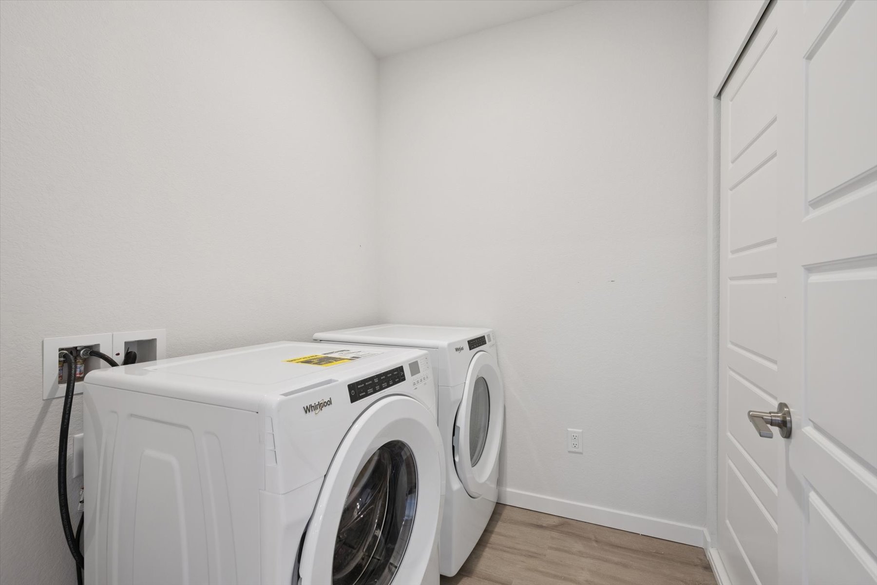 A white washing machine in a room.