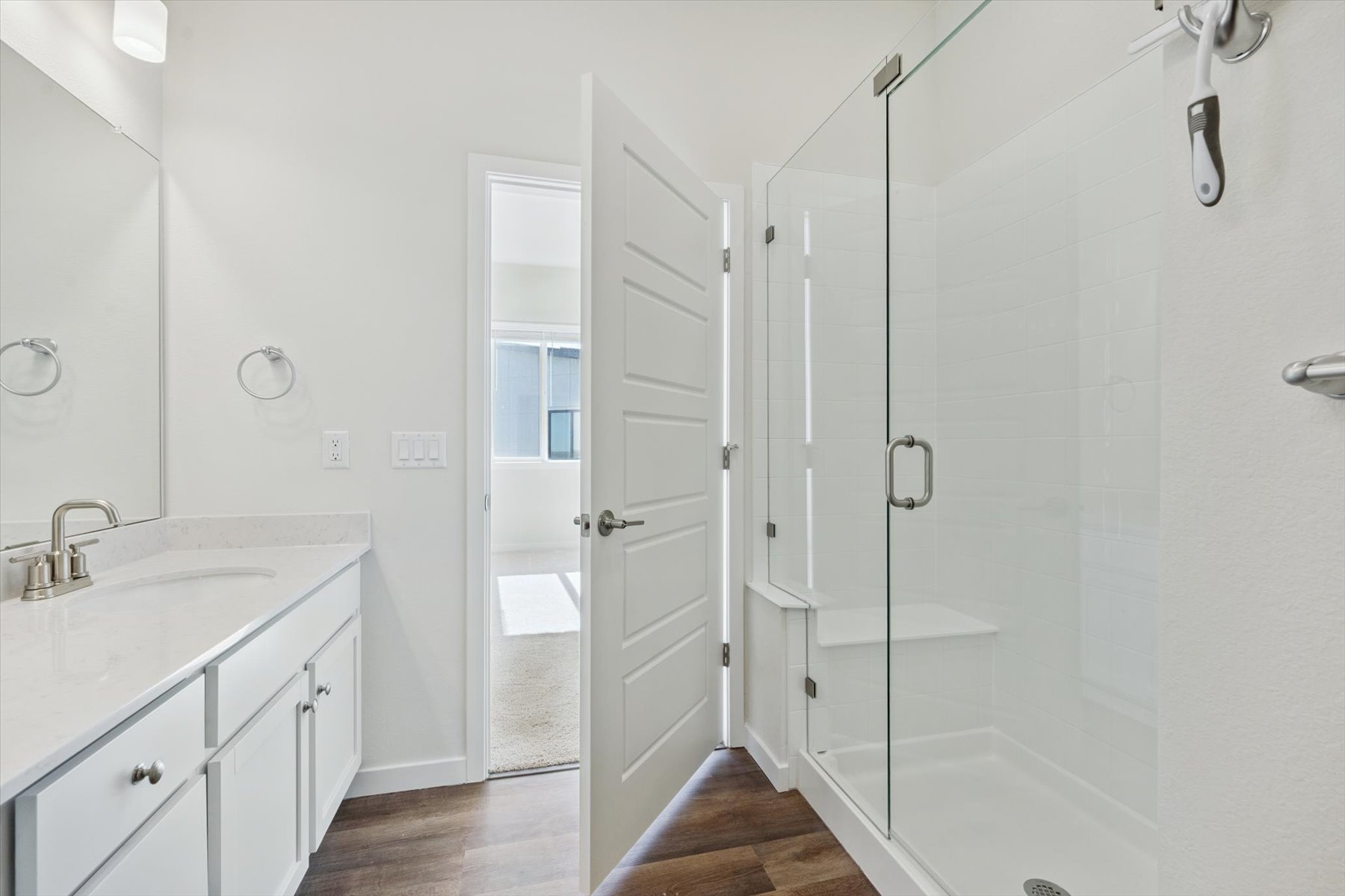 A bathroom with a glass shower.