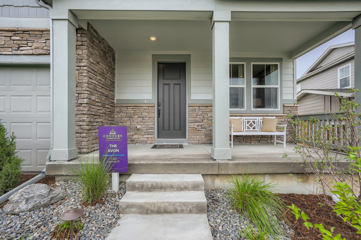 A house with a sign in front.