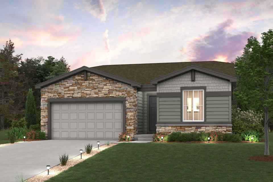 A house with a garage and a lawn in front of it.