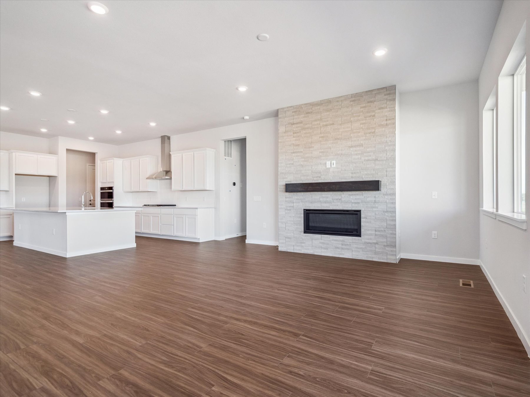 A large kitchen with a fireplace.