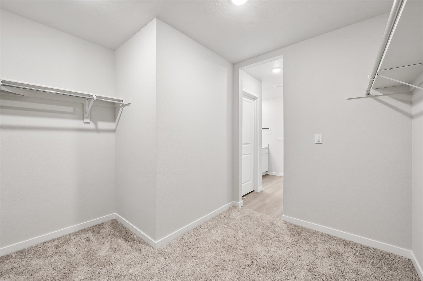 A hallway with white walls.