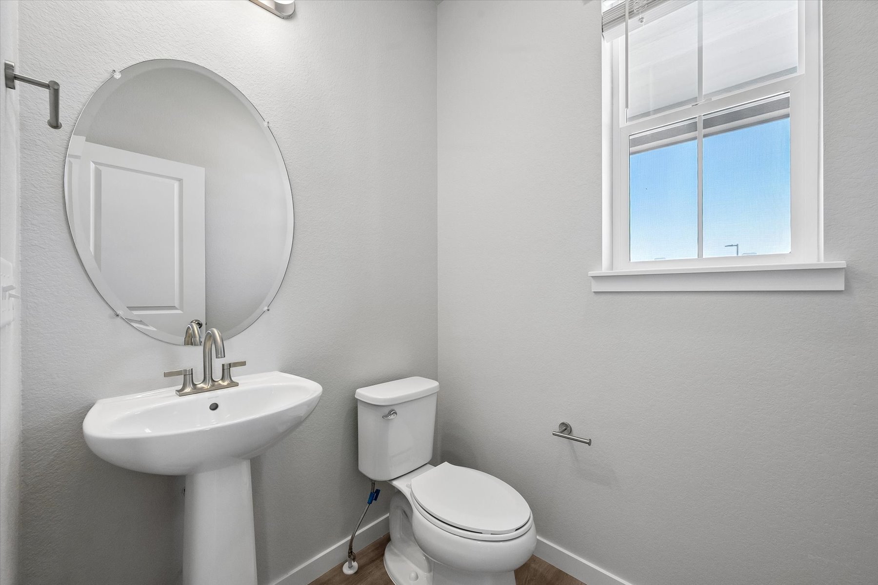 A bathroom with a sink and toilet.