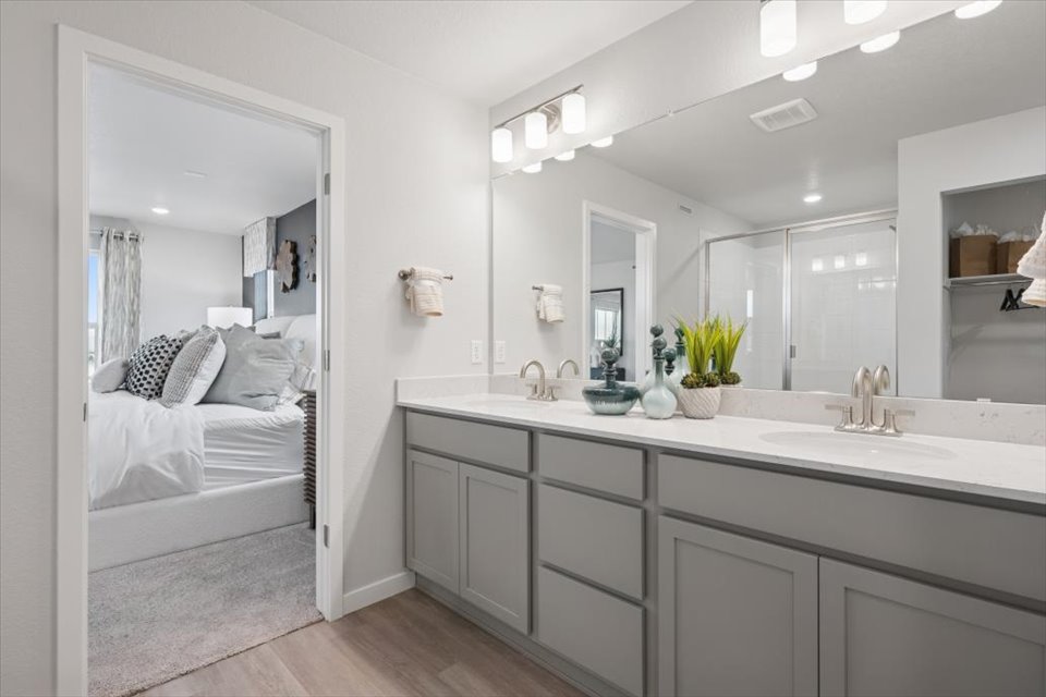 A bathroom with a large mirror.
