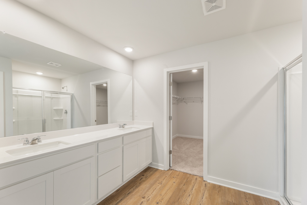 A bathroom with a glass shower.