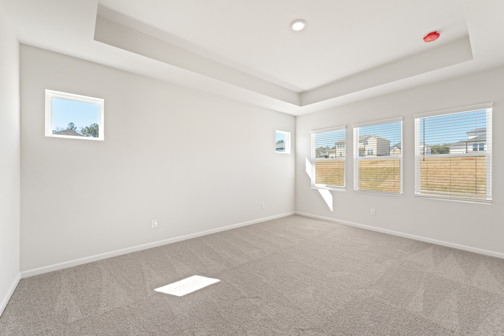 A room with a few paintings on the wall.