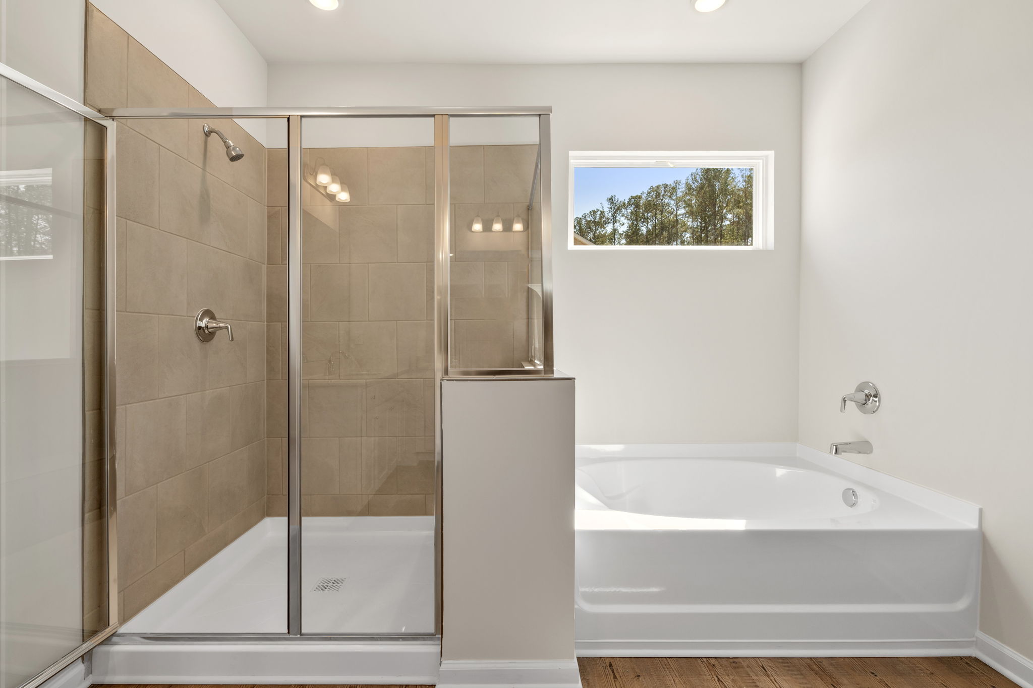 A bathroom with a glass shower.