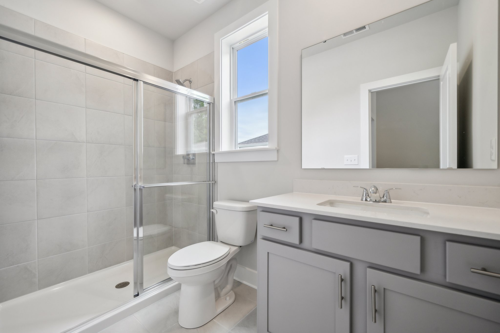 A bathroom with a glass shower.