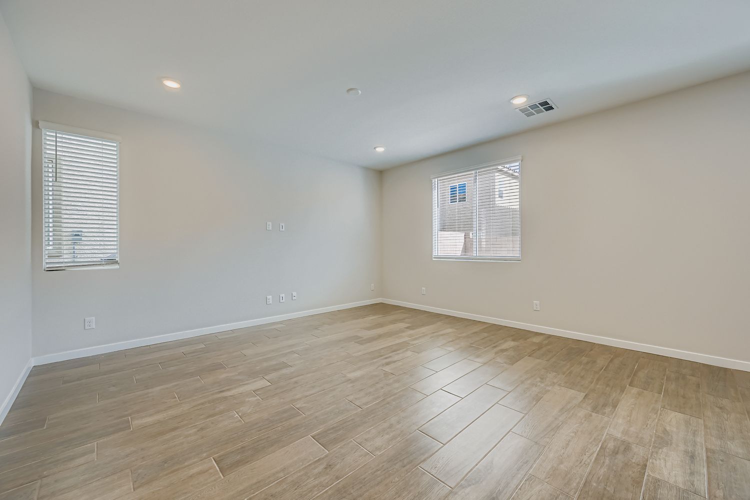 A room with a wood floor and a wood floor.
