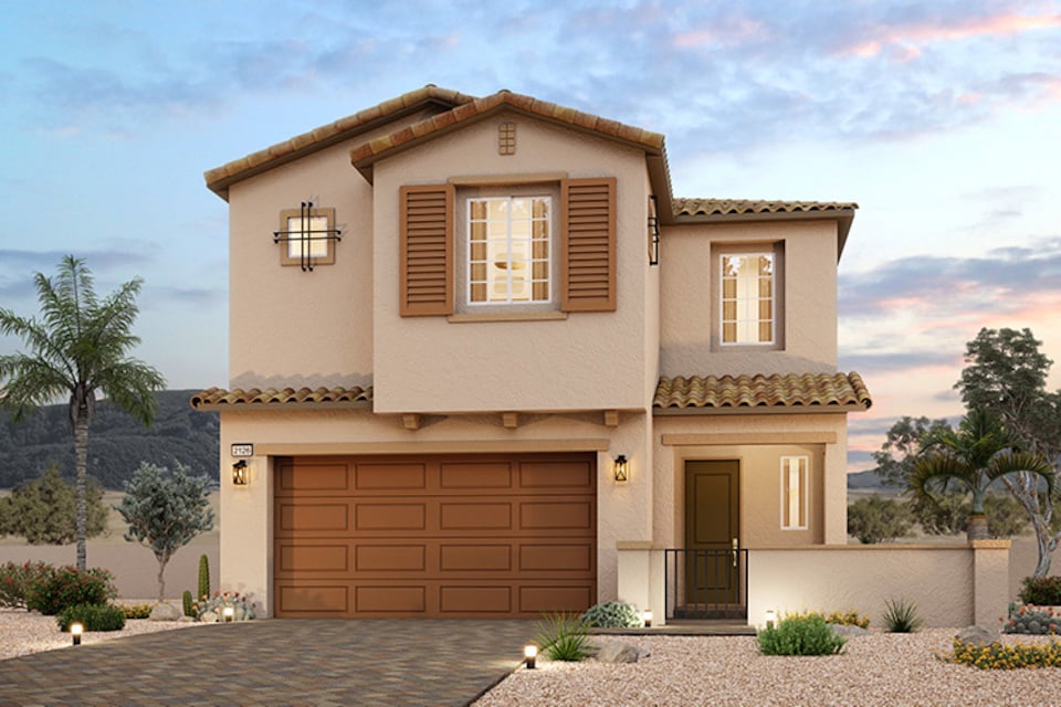 A house with a garage and trees.