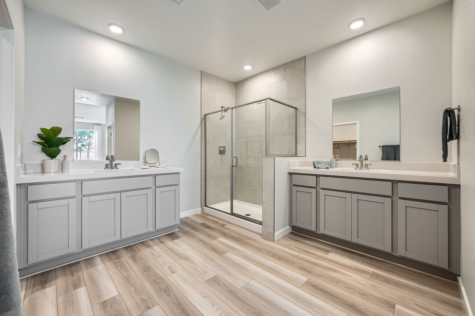 A large white kitchen with white cabinets.