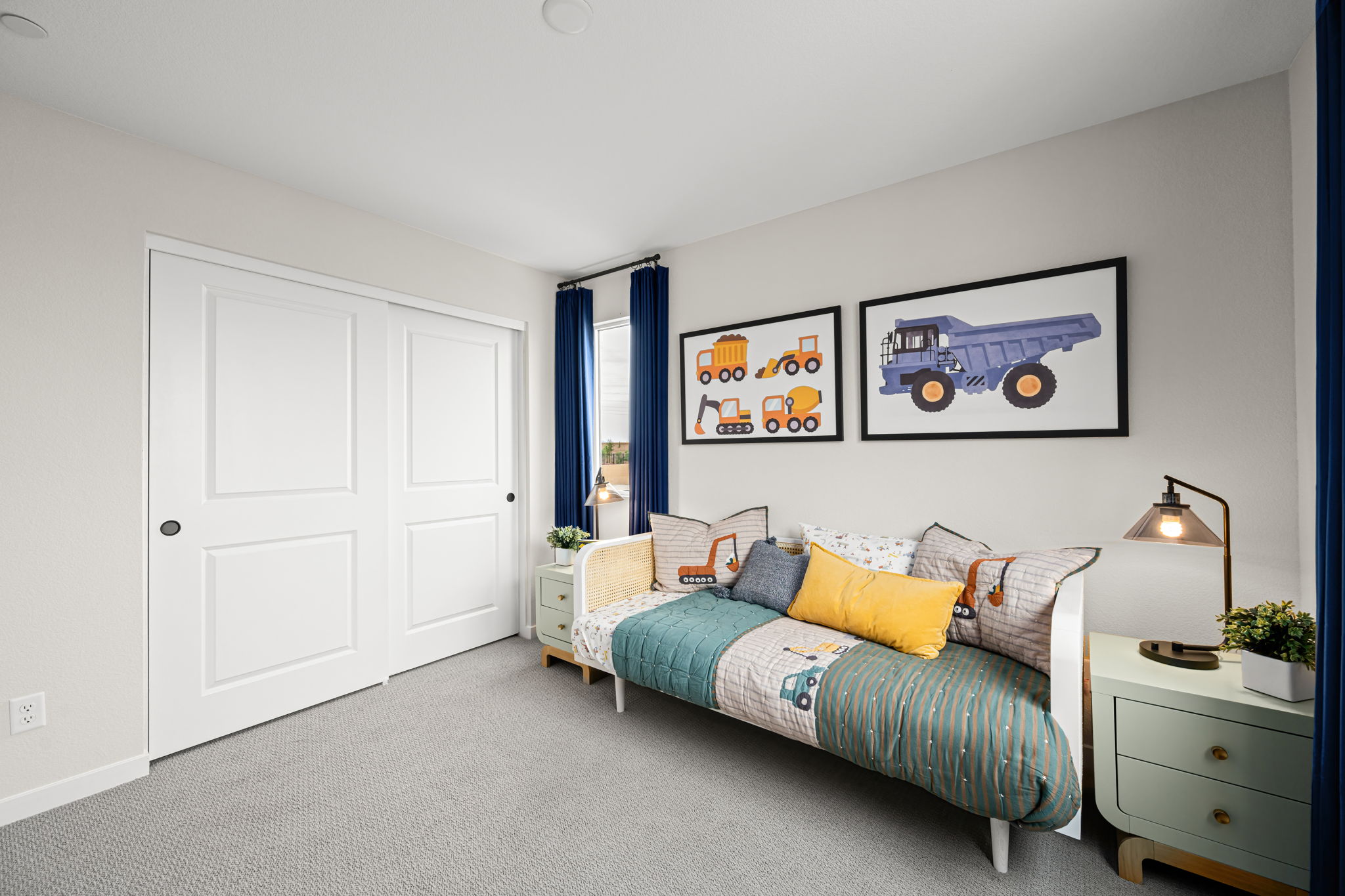 A bedroom with a bed and a dresser.