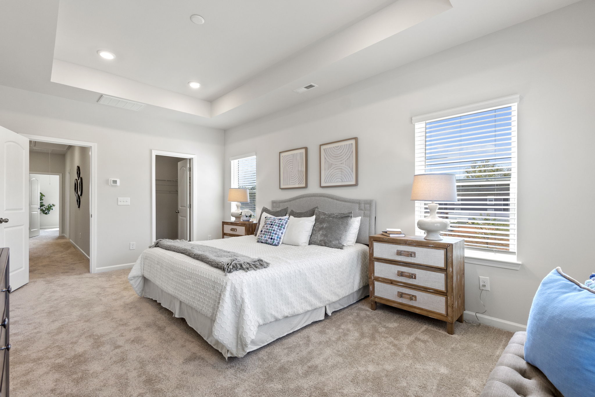 A bedroom with a bed and a dresser.