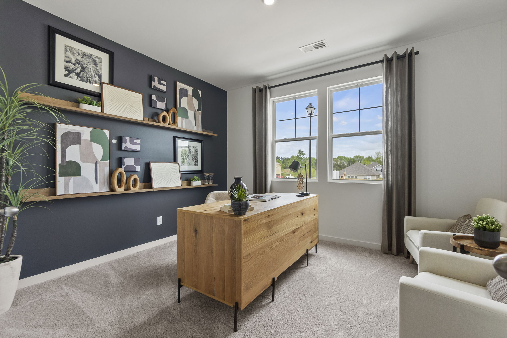 A room with a table and chairs.