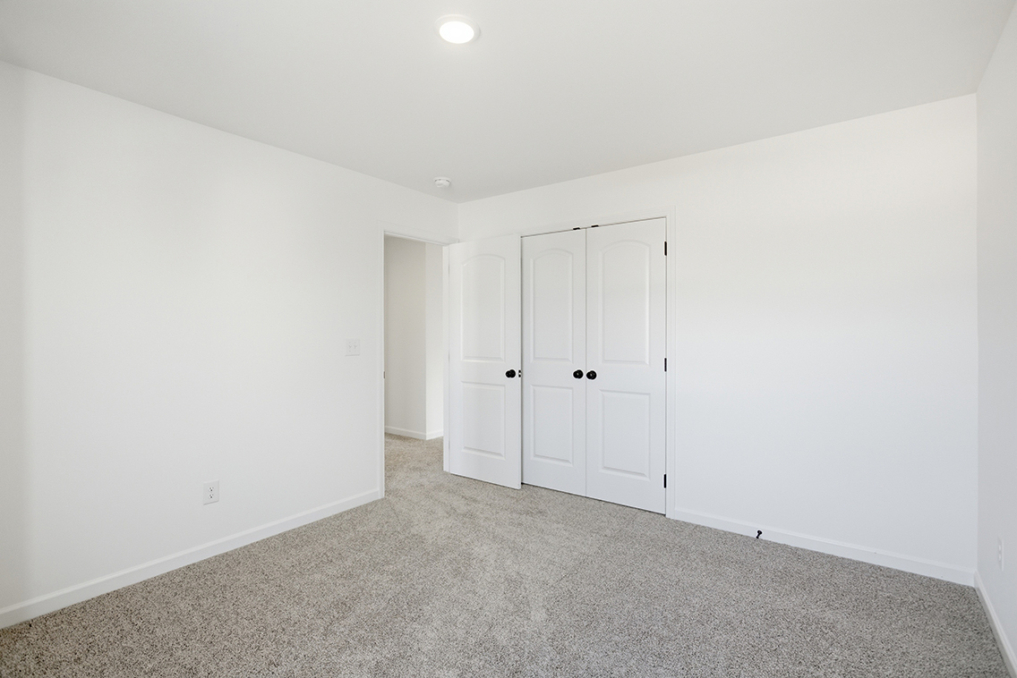 A room with white doors.