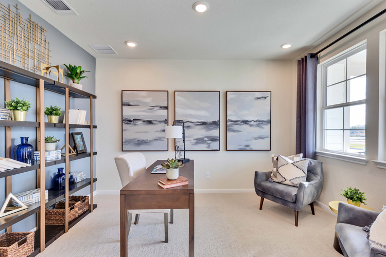 A room with a table and chairs.