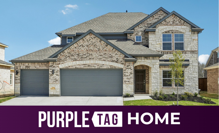 A house with garages and a driveway.