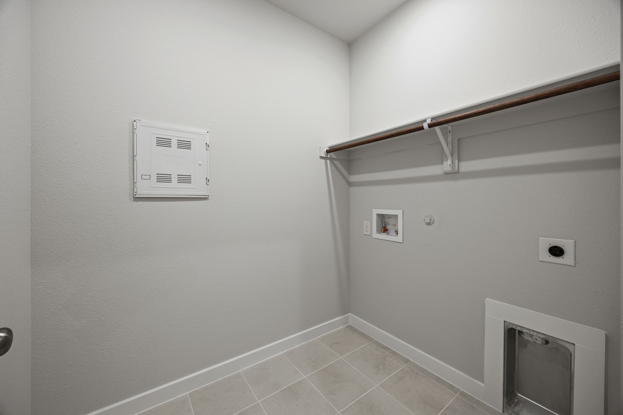 A white wall with a television and a white wall.