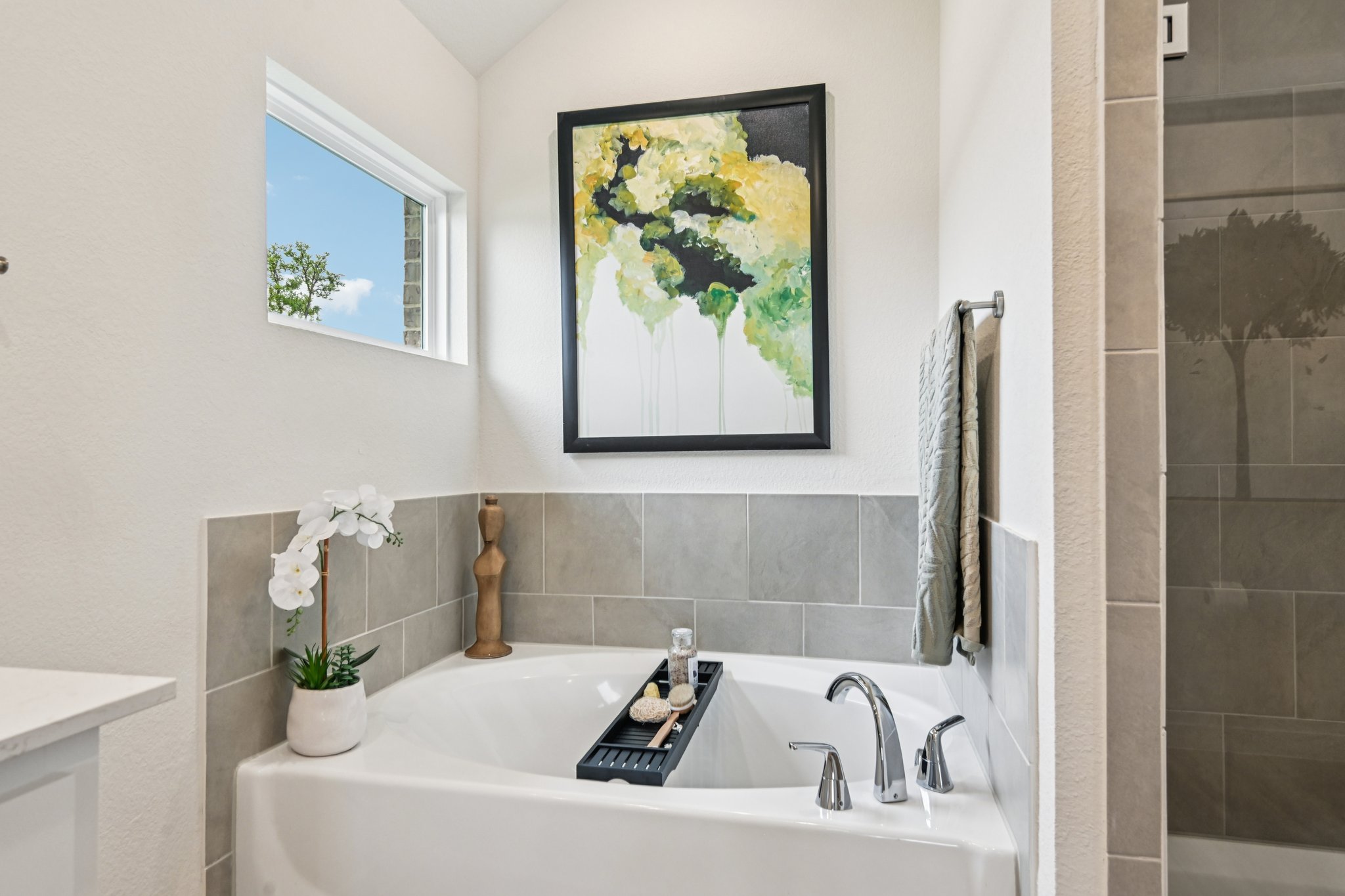 A bathroom with a tub and a sink.