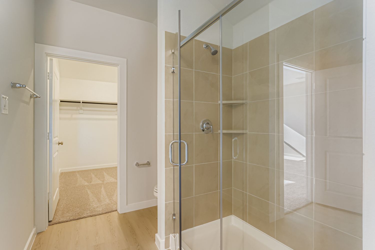 A bathroom with a glass shower.
