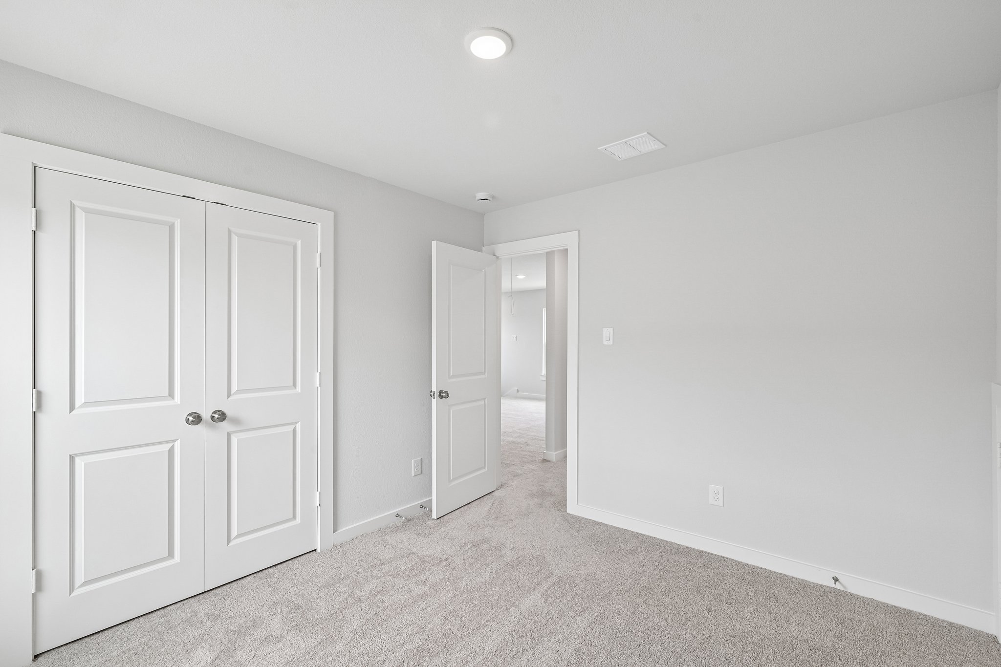 A room with white doors.