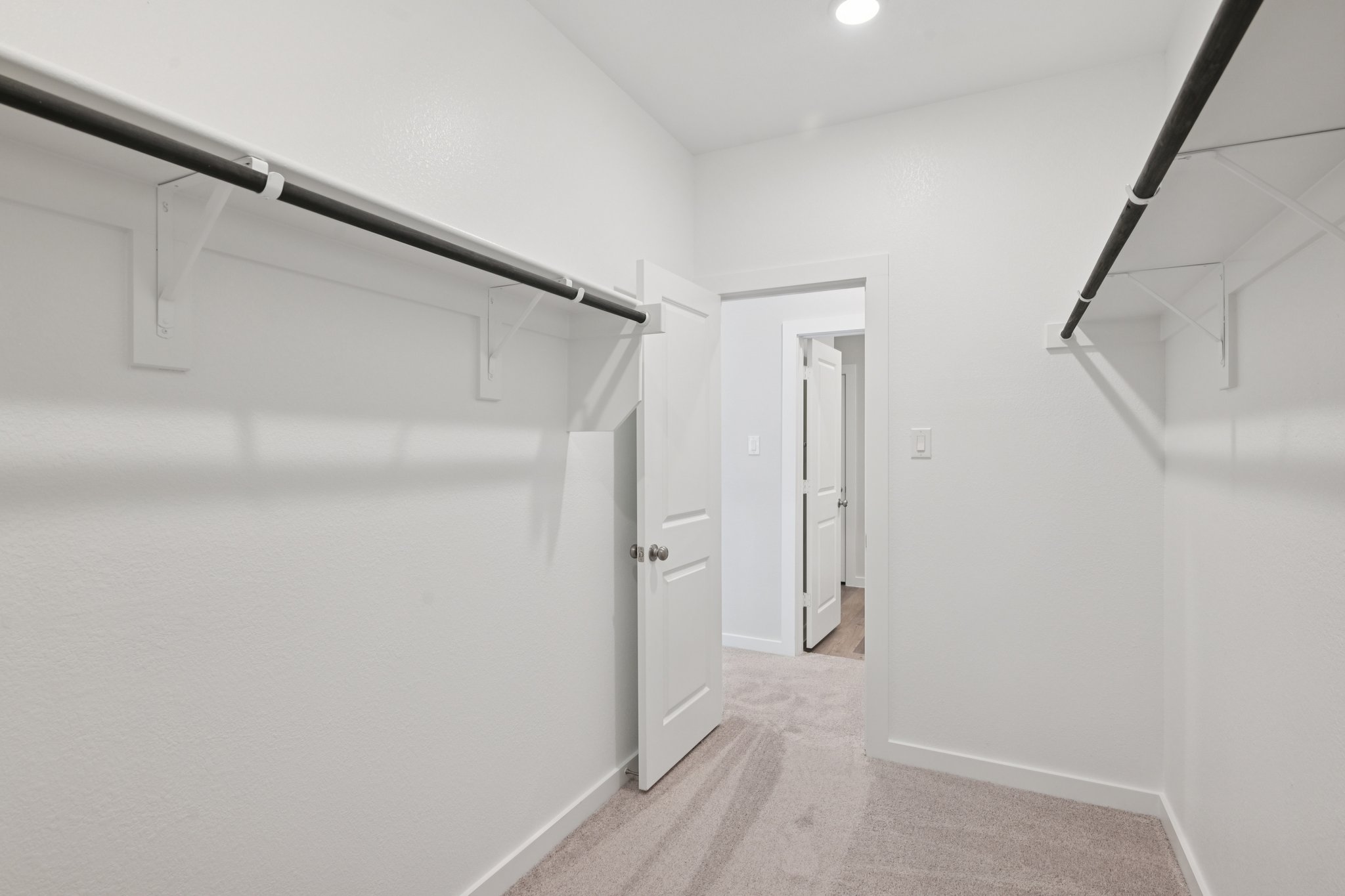 A hallway with white walls.