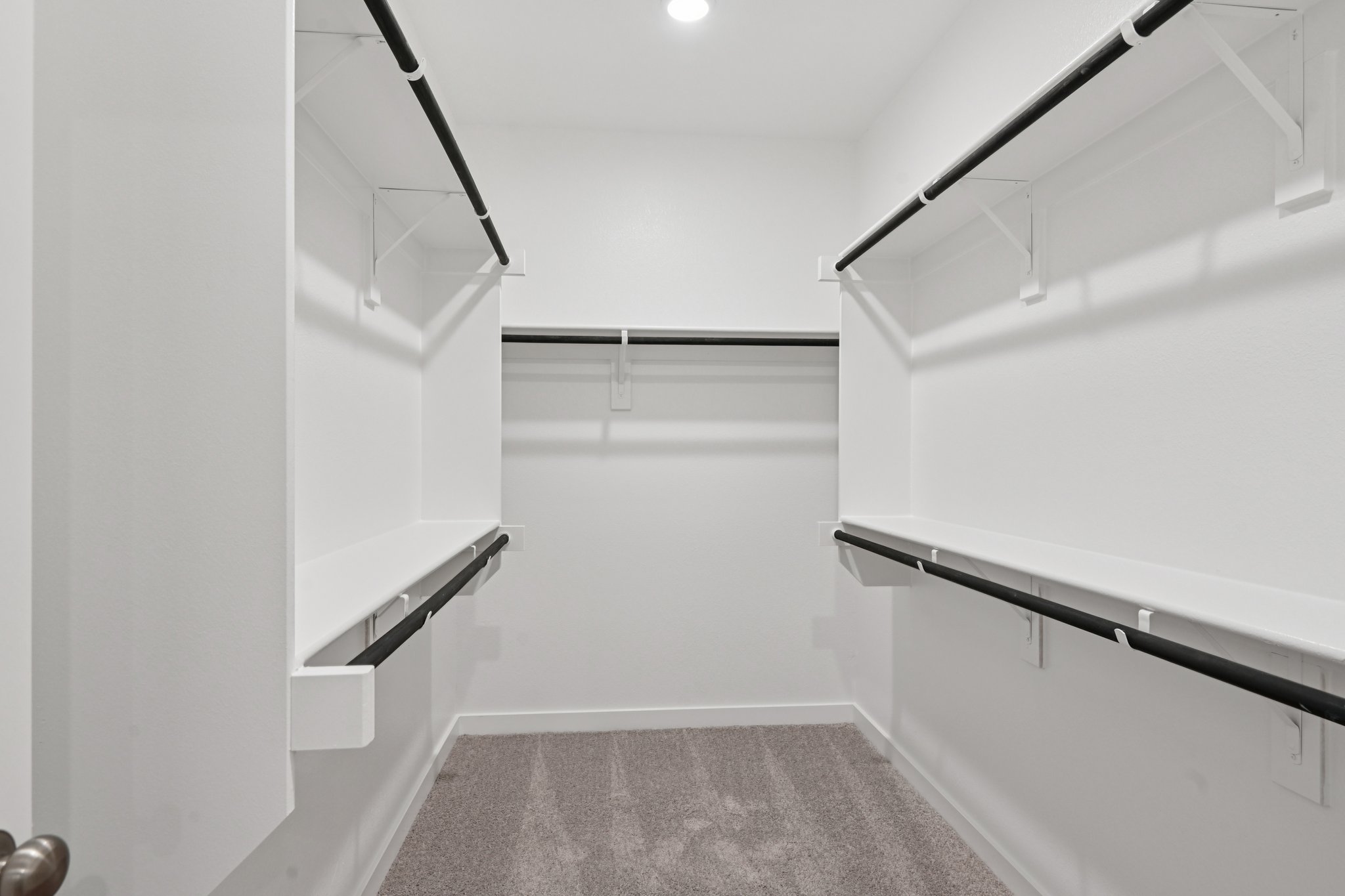 A white room with a staircase.