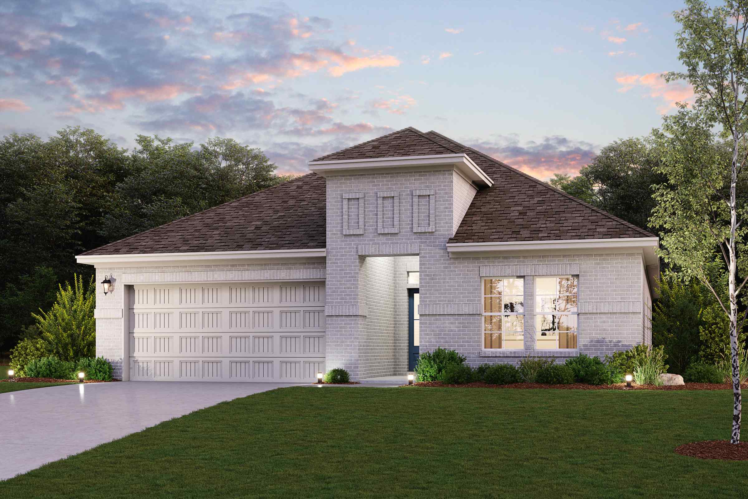 A house with a lawn in front of it.