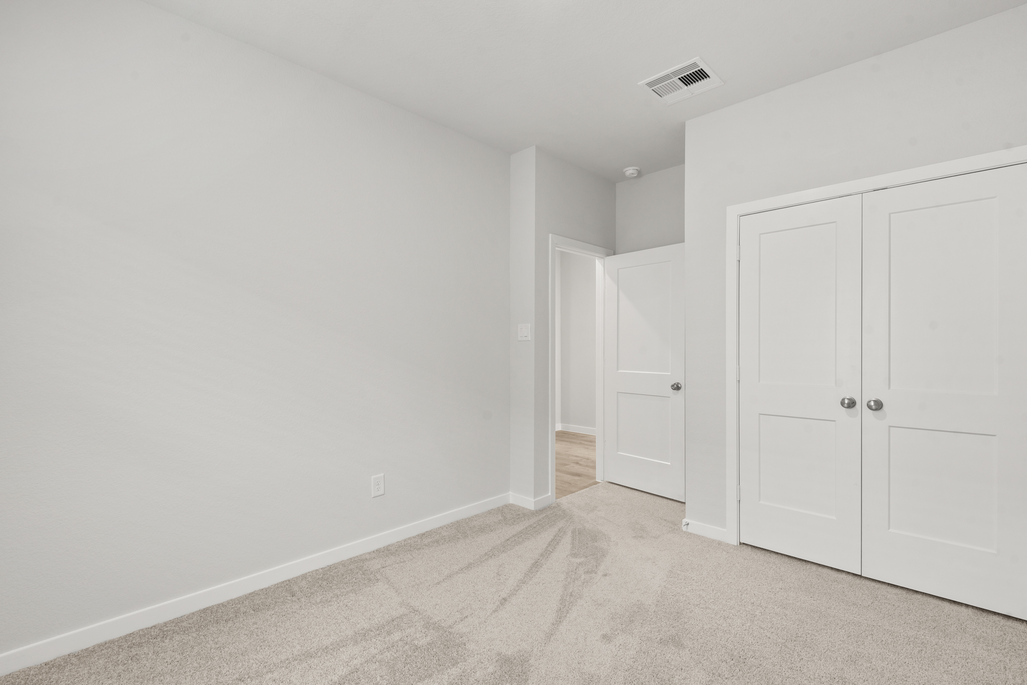 A room with white doors.