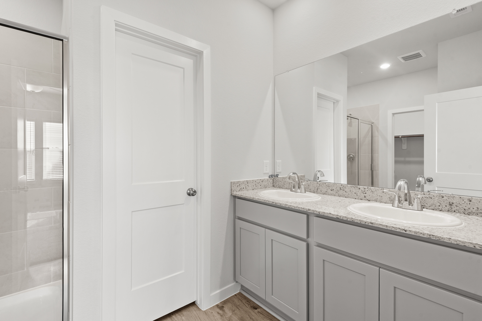 A bathroom with a marble countertop.
