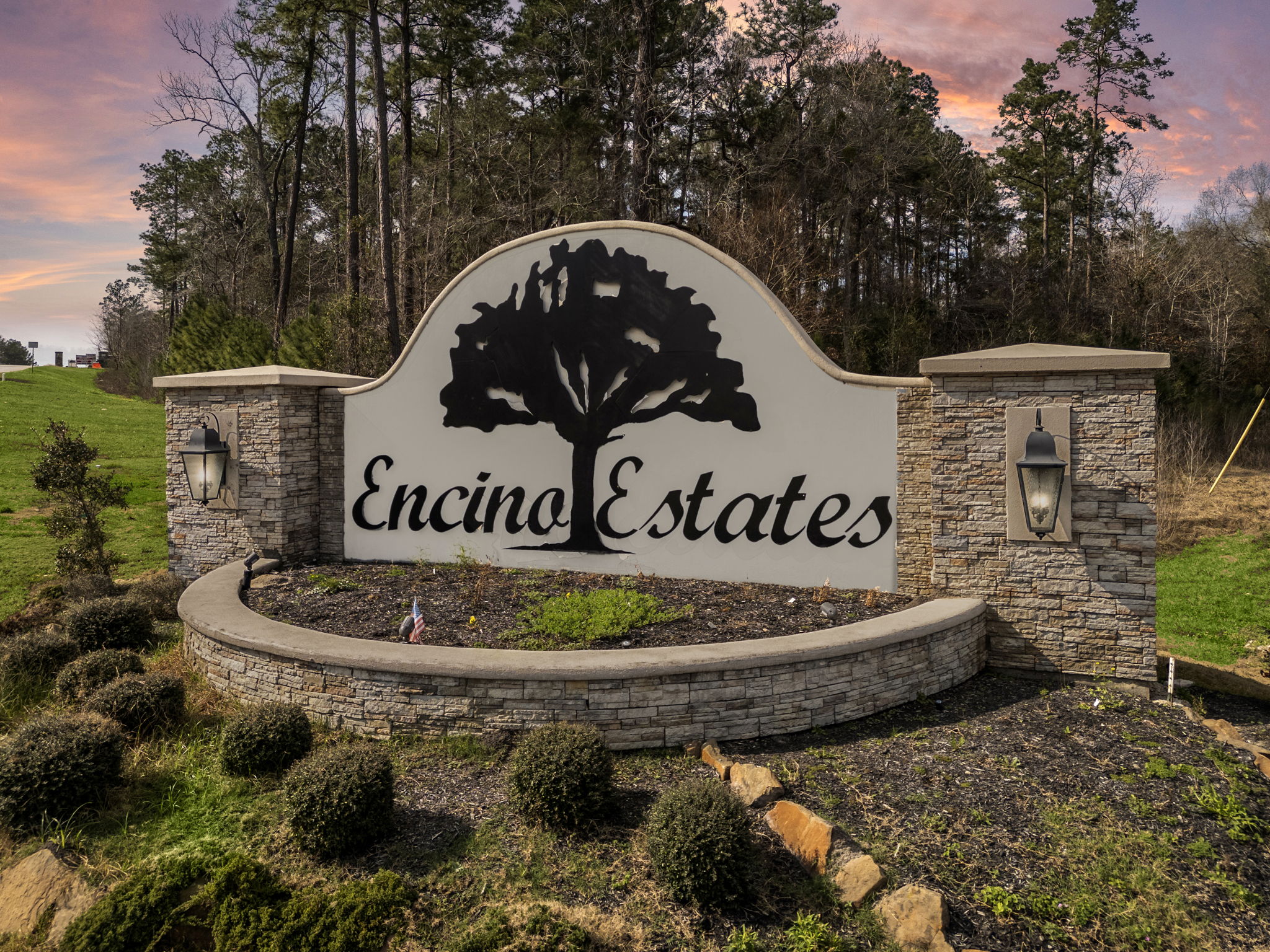 A sign on a stone wall.