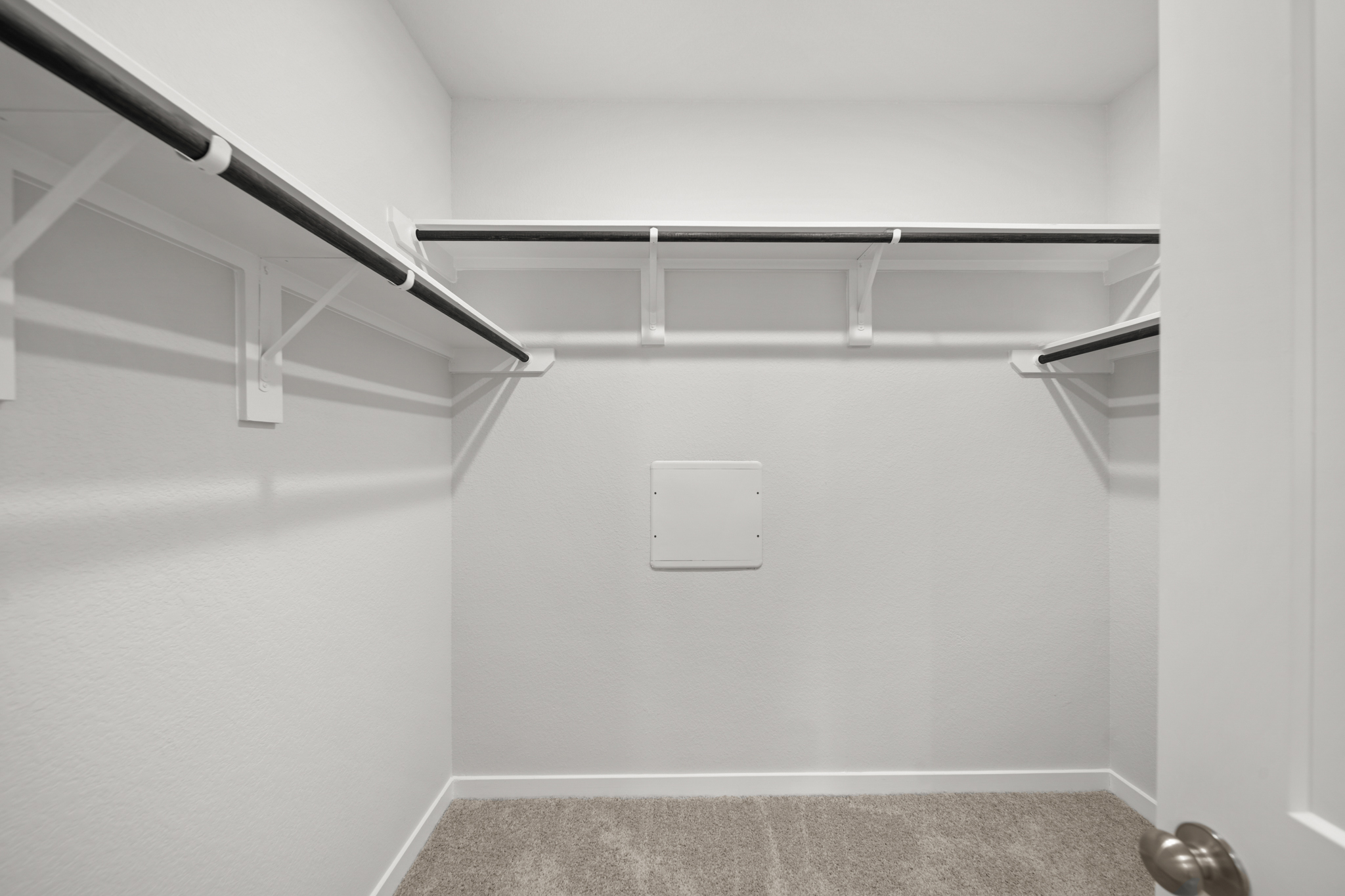 A staircase with a light on the side.