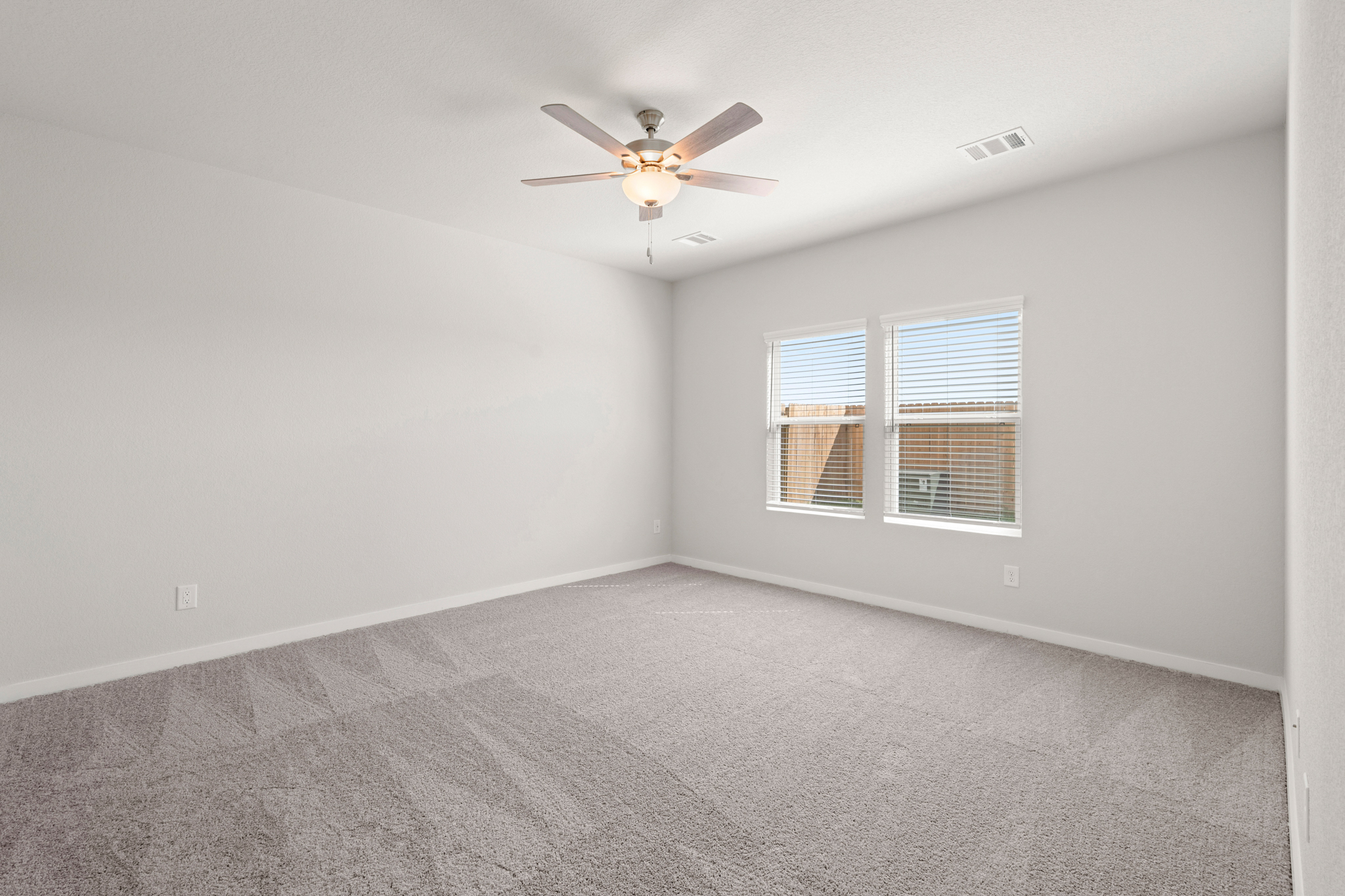 A ceiling fan in a room.