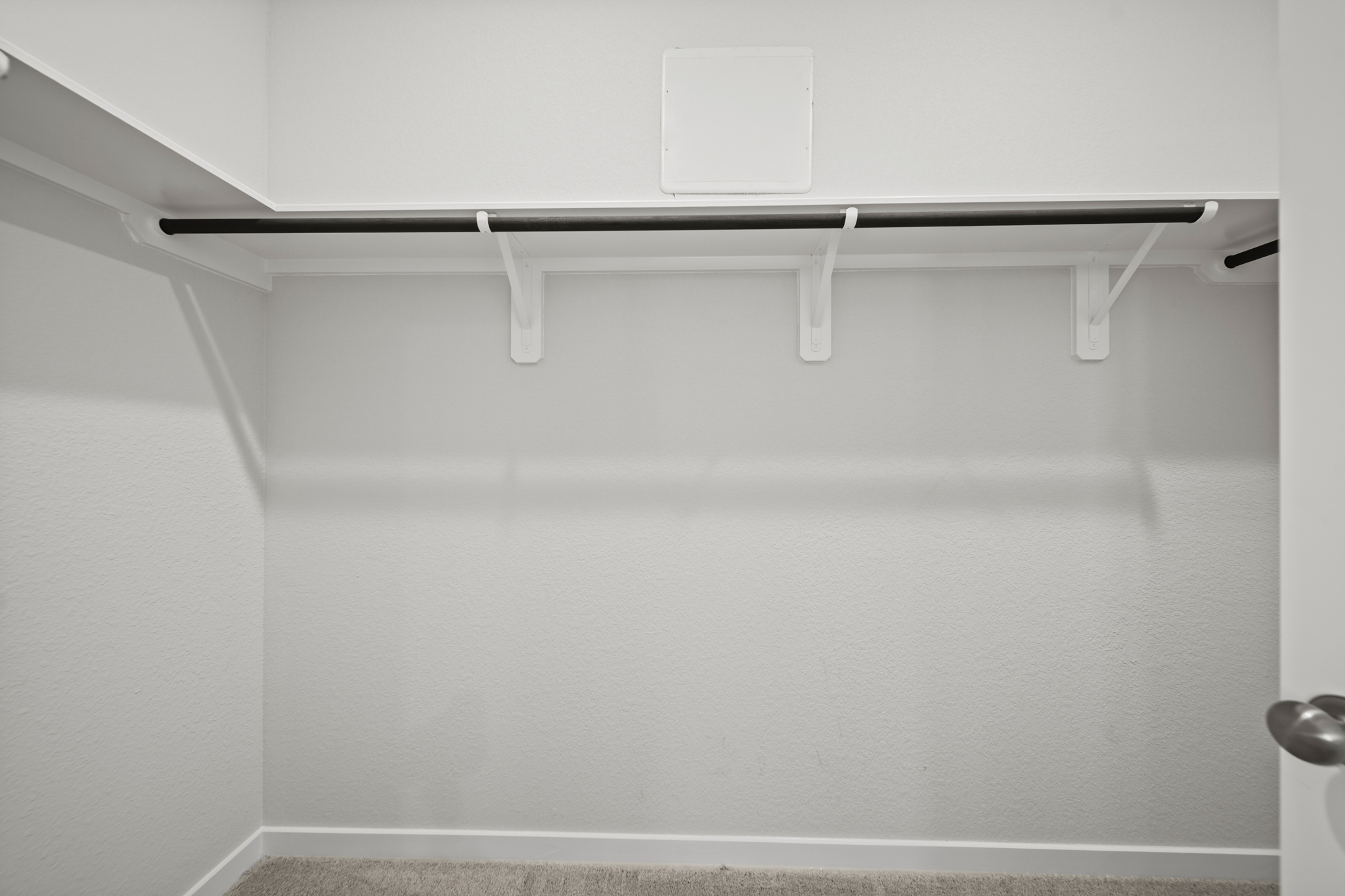 A white ceiling with a light fixture.