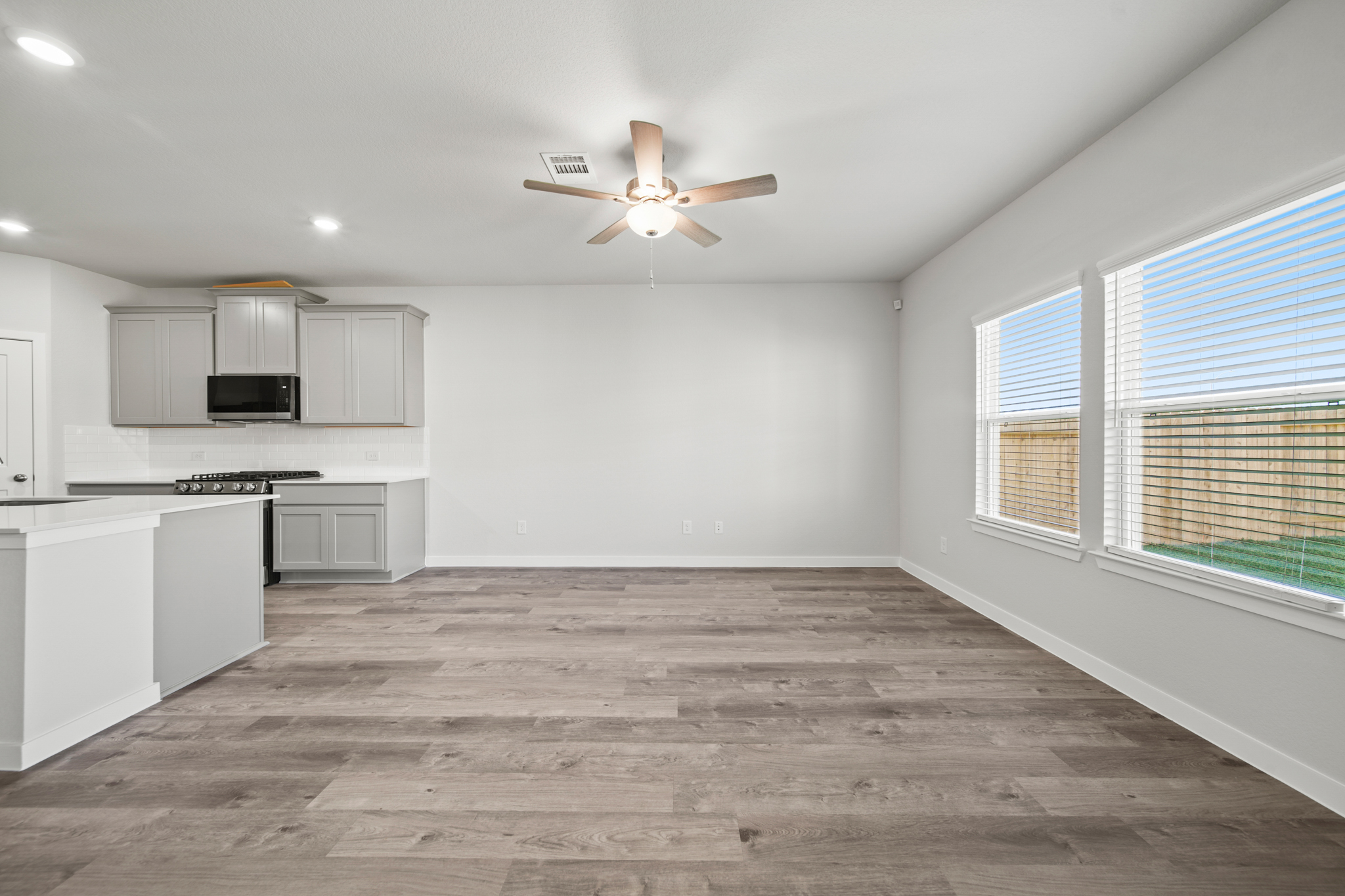 A kitchen with a wood floor.