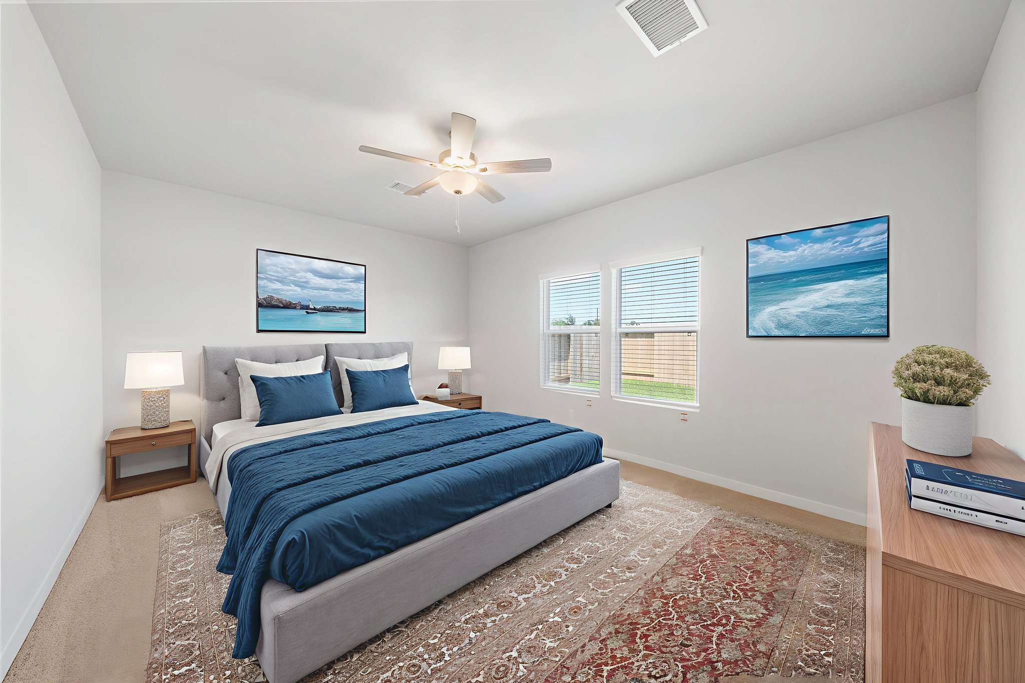 A bedroom with a bed and a fan.